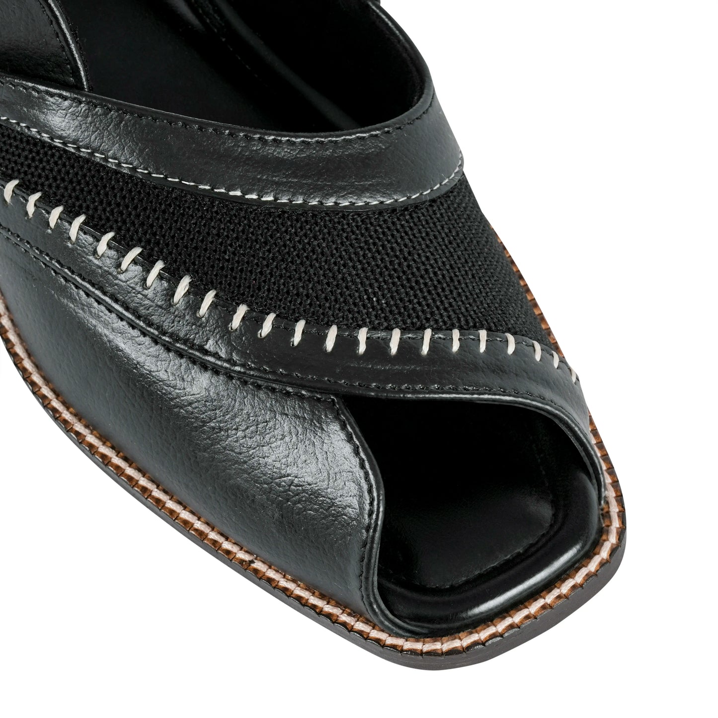 Black open-toe sandal with stitching detail on a white background